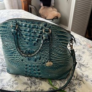 It is a beautiful blue Brahmin bag